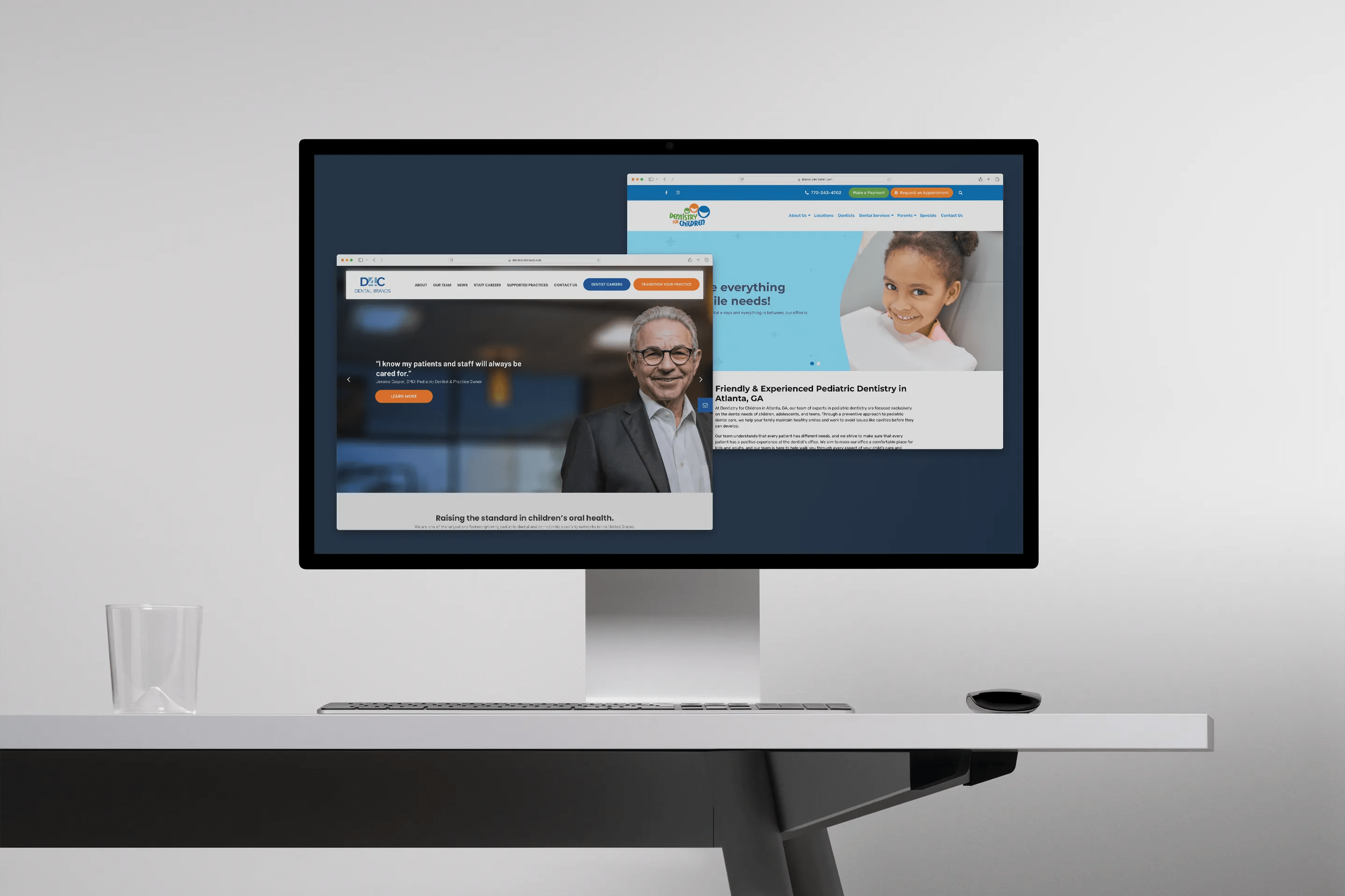 Computer monitor displaying two overlapping dental websites: D4C Dental Brands with a male dentist’s portrait and a second site featuring a smiling young girl in a dental chair.